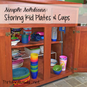 This Simple Solution for storing kid plates and cups will give your kids a chance to be more independent & helpful and will make your life easier.